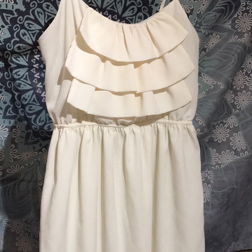 A creamy color dress.